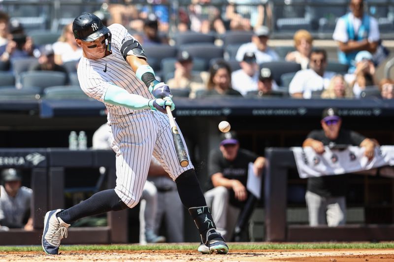 Aug 25, 2024; Bronx, New York, USA;  New York Yankees center fielder Aaron Judge (99) hits a two run home run in the first inning against the Colorado Rockies at Yankee Stadium. Mandatory Credit: Wendell Cruz-USA TODAY Sports