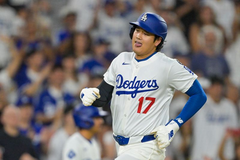 Sep 10, 2025; Los Angeles, California, USA; Los Angeles Dodgers designated hitter Shohei Ohtani (17) rounds the bases before scoring on a double by shortstop Mookie Betts (not pictured) in the second inning against the Colorado Rockies at Dodger Stadium. Mandatory Credit: Jayne Kamin-Oncea-Imagn Images