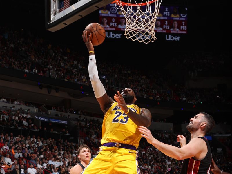 MIAMI, FL - DECEMBER 4: LeBron James #23 of the Los Angeles Lakers drives to the basket during the game against the Miami Heat on December 4, 2024 at Kaseya Center in Miami, Florida. NOTE TO USER: User expressly acknowledges and agrees that, by downloading and or using this Photograph, user is consenting to the terms and conditions of the Getty Images License Agreement. Mandatory Copyright Notice: Copyright 2024 NBAE (Photo by Joe Murphy/NBAE via Getty Images)