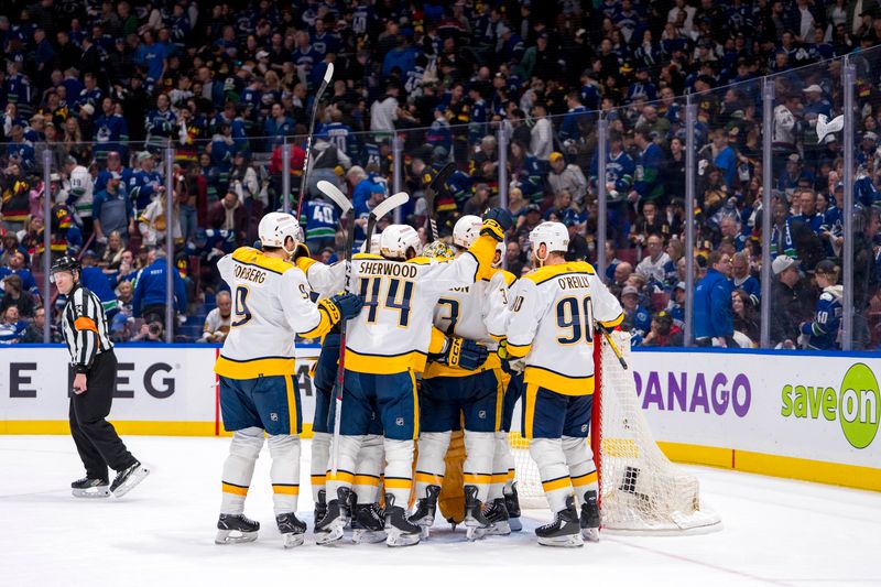 Apr 30, 2024; Vancouver, British Columbia, CAN; THe Nashville Predators celebrate their victory against the Vancouver Canucks at the end of game five of the first round of the 2024 Stanley Cup Playoffs at Rogers Arena. Mandatory Credit: Bob Frid-USA TODAY Sports