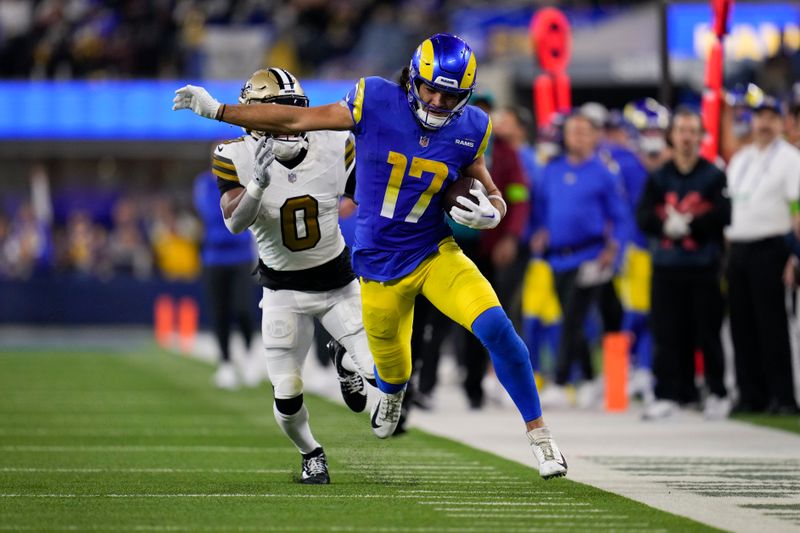 Los Angeles Rams wide receiver Puka Nacua (17) runs past New Orleans Saints safety Ugo Amadi (0) during the second half of an NFL football game Thursday, Dec. 21, 2023, in Inglewood, Calif. (AP Photo/Ashley Landis)