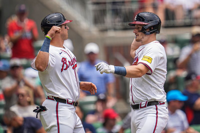 Jun 19, 2024; Cumberland, Georgia, USA; Atlanta Braves catcher Sean Murphy (right) reacts with third baseman Austin Riley (27) after hitting a two run home run against the Detroit Tigers during the third inning at Truist Park. Mandatory Credit: Dale Zanine-USA TODAY Sports