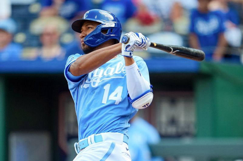 Sep 4, 2023; Kansas City, Missouri, USA; Kansas City Royals left fielder Edward Olivares (14) hits a home run during the sixth inning against the Chicago White Sox at Kauffman Stadium. Mandatory Credit: Jay Biggerstaff-USA TODAY Sports