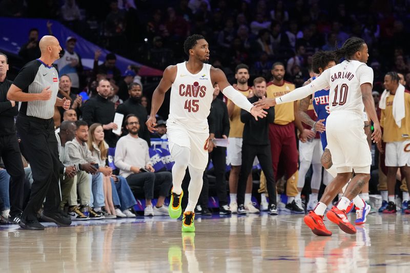 PHILADELPHIA, PA - NOVEMBER 13: Donovan Mitchell #45 and Darius Garland #10 of the Cleveland Cavaliers high five during the game against the Philadelphia 76ers on November 13, 2024 at the Wells Fargo Center in Philadelphia, Pennsylvania NOTE TO USER: User expressly acknowledges and agrees that, by downloading and/or using this Photograph, user is consenting to the terms and conditions of the Getty Images License Agreement. Mandatory Copyright Notice: Copyright 2024 NBAE (Photo by Jesse D. Garrabrant/NBAE via Getty Images)