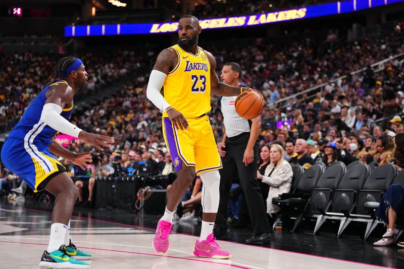 LAS VEGAS, NV - OCTOBER 15: LeBron James #23 of the Los Angeles Lakers dribbles the ball during the game against the Golden State Warriors during the 2024 NBA Preseason on October 15, 2024 at T-Mobile Arena in Las Vegas, Nevada. NOTE TO USER: User expressly acknowledges and agrees that, by downloading and or using this photograph, User is consenting to the terms and conditions of the Getty Images License Agreement. Mandatory Copyright Notice: Copyright 2024 NBAE  (Photo by Jeff Bottari/NBAE via Getty Images)