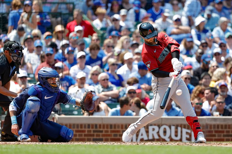 Jul 19, 2024; Chicago, Illinois, USA; Arizona Diamondbacks first baseman Christian Walker (53) hits a two-run single against the Chicago Cubs during the third inning at Wrigley Field. Mandatory Credit: Kamil Krzaczynski-USA TODAY Sports