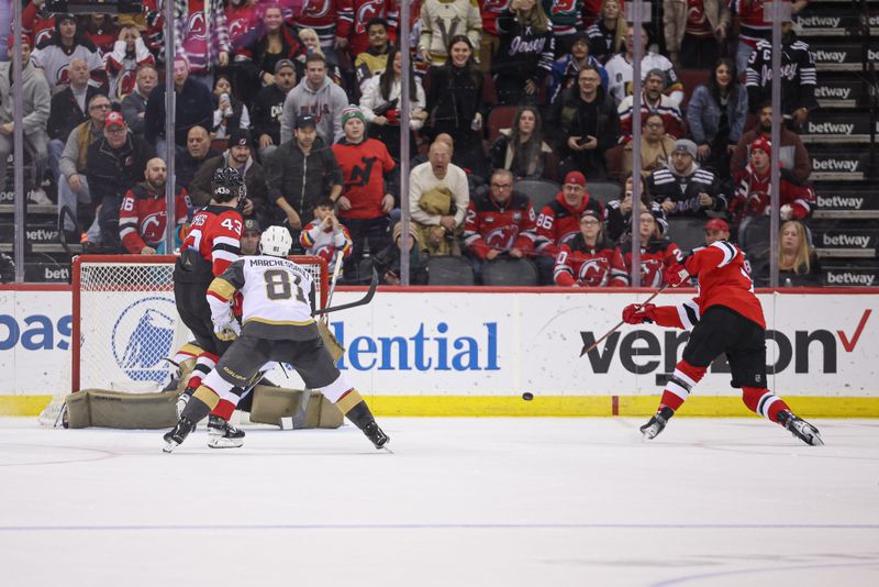 Jan 22, 2024; Newark, New Jersey, USA; New Jersey Devils right wing Tyler Toffoli (73) scores the game-winning goal in overtime against Vegas Golden Knights goaltender Logan Thompson (36) in front of Golden Knights right wing Jonathan Marchessault (81) and defenseman Luke Hughes (43) at Prudential Center. Mandatory Credit: Vincent Carchietta-USA TODAY Sports