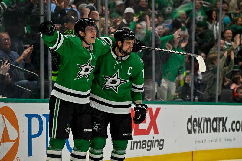 Nov 20, 2023; Dallas, Texas, USA; Dallas Stars center Roope Hintz (24) and left wing Jamie Benn (14) celebrates a goal scored by Benn against the New York Rangers during the second period at the American Airlines Center. Mandatory Credit: Jerome Miron-USA TODAY Sports