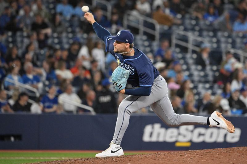 May 14, 2025; Toronto, Ontario, CAN;  Tampa Bay Rays relief pitcher Eric Orze (17) delivers a pitch against the Toronto Blue Jays in the eighth inning at Rogers Centre. Mandatory Credit: Dan Hamilton-Imagn Images