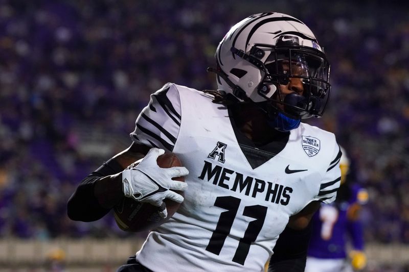 Oct 15, 2022; Greenville, North Carolina, USA;  Memphis Tigers wide receiver Joseph Scates (11) scores a touchdown on his catch against the East Carolina Pirates  in the overtime at Dowdy-Ficklen Stadium. Mandatory Credit: James Guillory-USA TODAY Sports