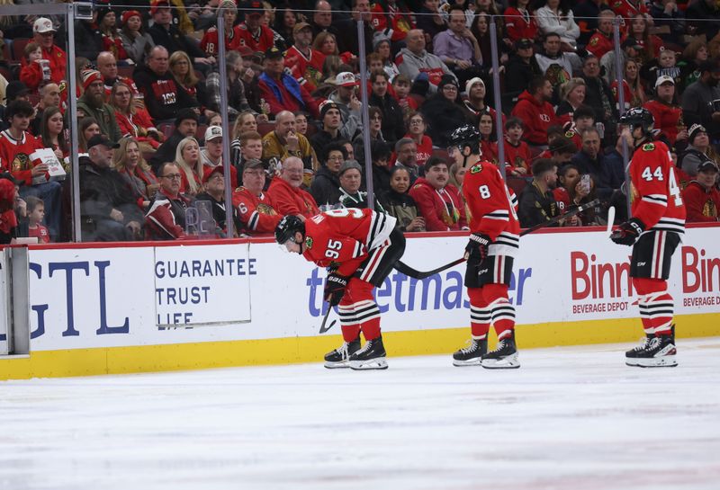 Jan 4, 2026; Chicago, Illinois, USA; Chicago Blackhawks right wing Ilya Mikheyev (95) skates back to the bench following a hit during the second period against the Vegas Golden Knights at United Center. Mandatory Credit: Talia Sprague-Imagn Images