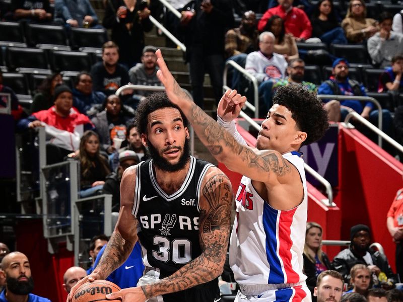 DETROIT, MI - JANUARY 10: Julian Champagnie #30 of the San Antonio Spurs handles the ball during the game against the Detroit Pistons on January 10, 2024 at Little Caesars Arena in Detroit, Michigan. NOTE TO USER: User expressly acknowledges and agrees that, by downloading and/or using this photograph, User is consenting to the terms and conditions of the Getty Images License Agreement. Mandatory Copyright Notice: Copyright 2024 NBAE (Photo by Chris Schwegler/NBAE via Getty Images)