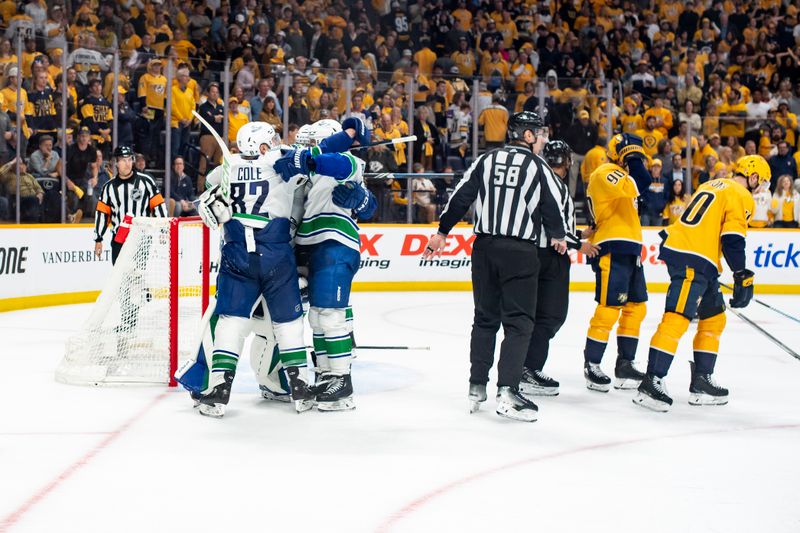 May 3, 2024; Nashville, Tennessee, USA; Vancouver Canucks celebrate the win against the Nashville Predators during game six of the first round of the 2024 Stanley Cup Playoffs at Bridgestone Arena. Mandatory Credit: Steve Roberts-USA TODAY Sports