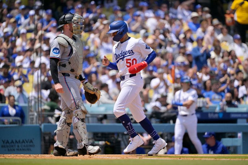 Apr 30, 2025; Los Angeles, California, USA; Los Angeles Dodgers shortstop Mookie Betts (50) scores on a hit by right fielder Teoscar Hernandez (not pictured) during the third inning at Dodger Stadium. Mandatory Credit: Jayne Kamin-Oncea-Imagn Images