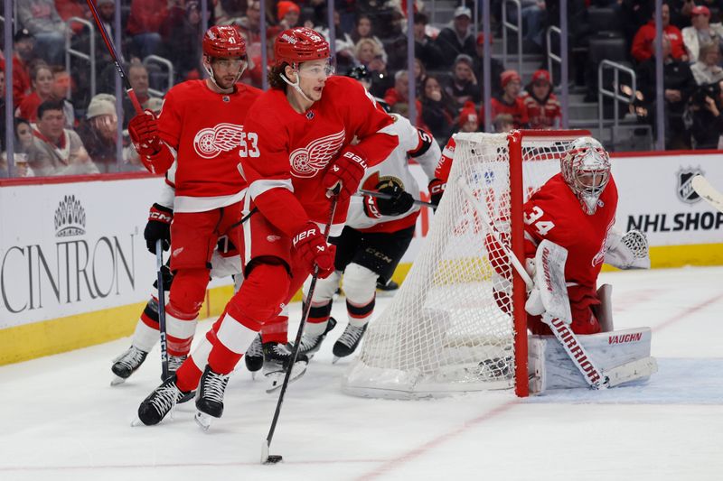 Jan 31, 2024; Detroit, Michigan, USA;  Detroit Red Wings defenseman Moritz Seider (53) skates with the puck in the third period against the Ottawa Senators at Little Caesars Arena. Mandatory Credit: Rick Osentoski-USA TODAY Sports