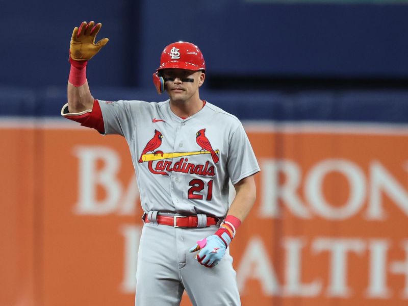 Aug 10, 2023; St. Petersburg, Florida, USA; St. Louis Cardinals center fielder Lars Nootbaar (21) doubles against the Tampa Bay Rays during the first inning at Tropicana Field. Mandatory Credit: Kim Klement Neitzel-USA TODAY Sports