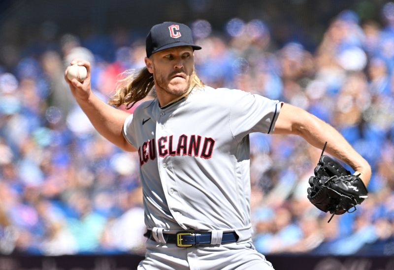 Aug 27, 2023; Toronto, Ontario, CAN;  Cleveland Guardians starting pitcher Noah Syndergaard (34) delivers a pitch against the Toronto Blue Jays in the first inning at Rogers Centre. Mandatory Credit: Dan Hamilton-USA TODAY Sports