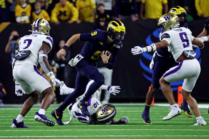 Jan 8, 2024; Houston, TX, USA; Michigan Wolverines quarterback J.J. McCarthy (9) runs the ball against Washington Huskies cornerback Dominique Hampton (7) during the third quarter in the 2024 College Football Playoff national championship game at NRG Stadium. Mandatory Credit: Troy Taormina-USA TODAY Sports