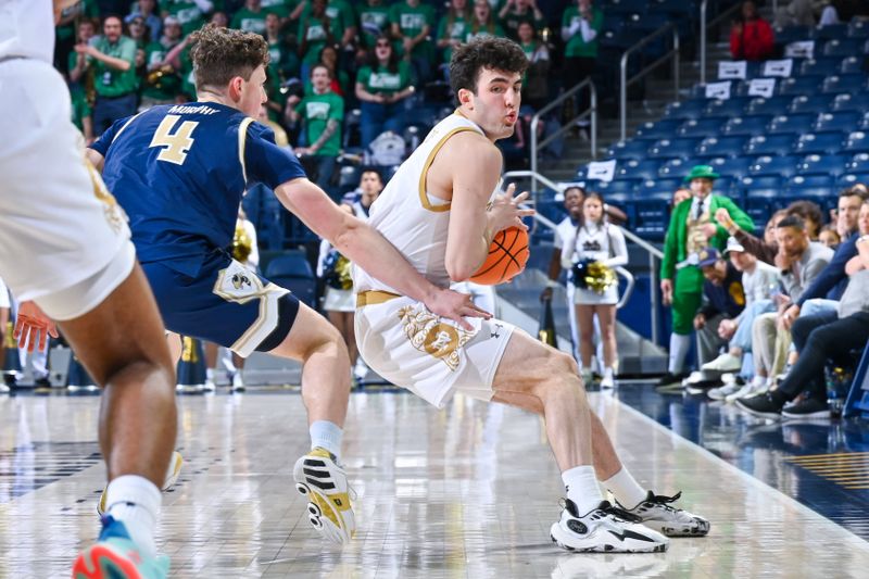 Feb 14, 2024; South Bend, Indiana, USA; Notre Dame Fighting Irish guard Logan Imes (2) grabs a rebound in front of Georgia Tech Yellow Jackets guard Carter Murphy (4) in the second half at the Purcell Pavilion. Mandatory Credit: Matt Cashore-USA TODAY Sports