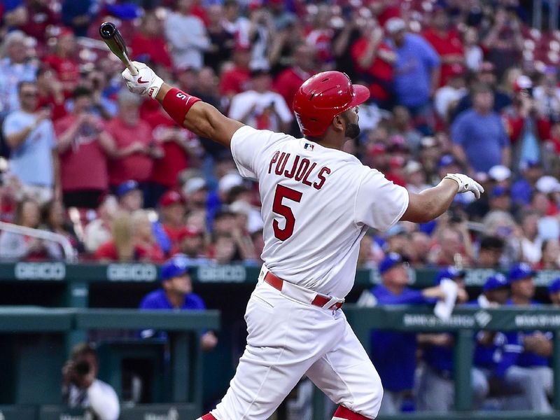 Apr 12, 2022; St. Louis, Missouri, USA;  St. Louis Cardinals designated hitter Albert Pujols (5) hits a solo home run against the Kansas City Royals during the first inning at Busch Stadium. Mandatory Credit: Jeff Curry-USA TODAY Sports