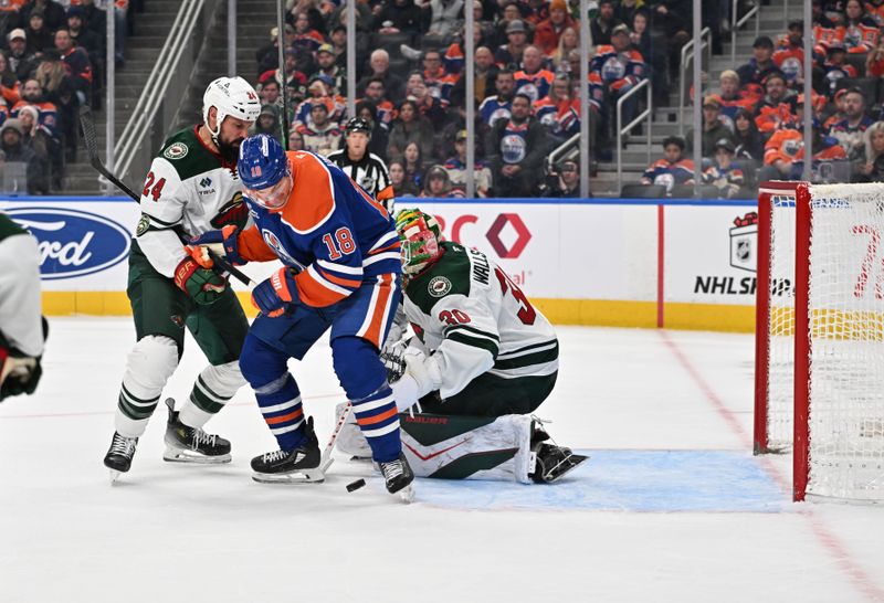 Dec 2, 2025; Edmonton, Alberta, CAN; Minnesota Wild defenseman Zach Bogosian (24) and Edmonton Oilers left wing Zach Hyman (18) battle in front of Minnesota Wild goalie Jesper Wallstedt (30) during the third period at Rogers Place. Mandatory Credit: Walter Tychnowicz-Imagn Images