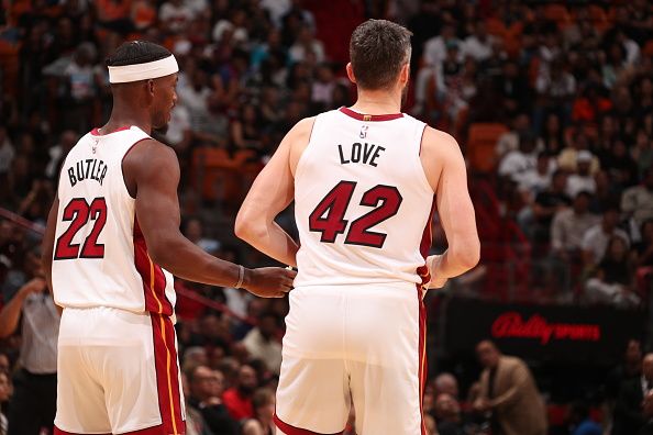 MIAMI, FL - DECEMBER 2: Jimmy Butler #22 of the Miami Heat talks with Kevin Love #42 during the game against the Indiana Pacers on December 2, 2023 at Kaseya Center in Miami, Florida. NOTE TO USER: User expressly acknowledges and agrees that, by downloading and or using this Photograph, user is consenting to the terms and conditions of the Getty Images License Agreement. Mandatory Copyright Notice: Copyright 2023 NBAE (Photo by Issac Baldizon/NBAE via Getty Images)