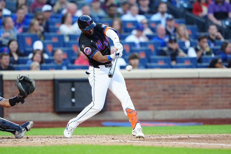 May 31, 2024; New York City, New York, USA;  New York Mets right fielder Starling Marte (6) hits an RBI triple against the Arizona Diamondbacks during the first inning at Citi Field. Mandatory Credit: Gregory Fisher-USA TODAY Sports