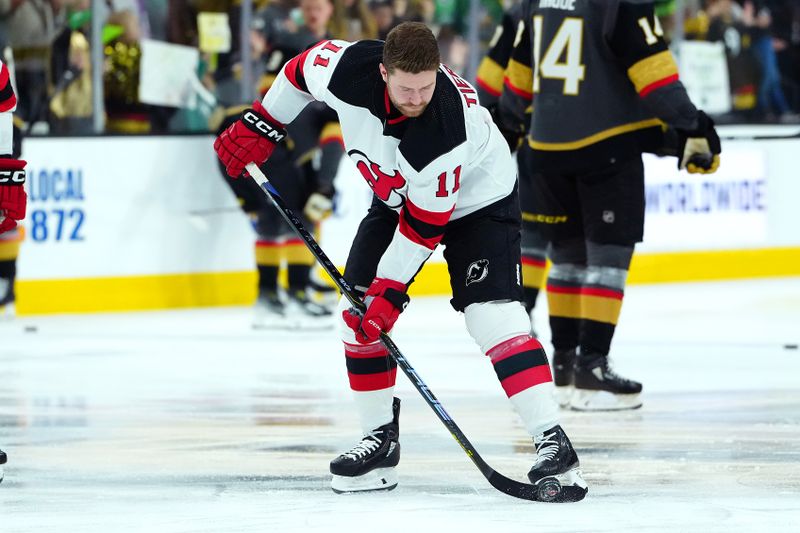 Mar 17, 2024; Las Vegas, Nevada, USA; New Jersey Devils center Chris Tierney (11) warms up before a game against the Vegas Golden Knights at T-Mobile Arena. Mandatory Credit: Stephen R. Sylvanie-USA TODAY Sports