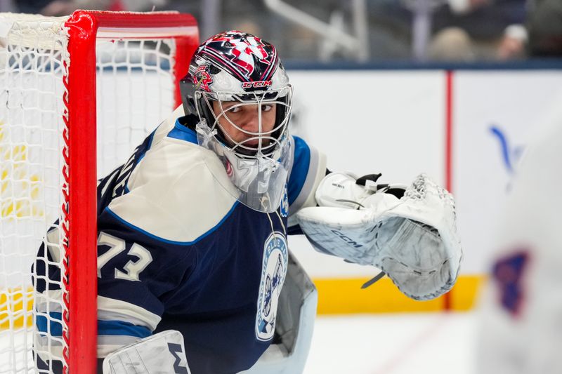 Feb 28, 2026; Columbus, Ohio, USA;  Columbus Blue Jackets goaltender Jet Greaves (73) defends the net against the New York Islanders in the first period at Nationwide Arena. Mandatory Credit: Aaron Doster-Imagn Images