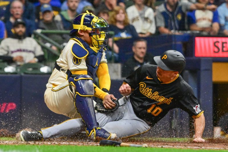 May 13, 2024; Milwaukee, Wisconsin, USA; Milwaukee Brewers catcher William Contreras (24) tags out Pittsburgh Pirates right fielder Bryan Reynolds (10) trying to score in the seventh inning at American Family Field. Mandatory Credit: Benny Sieu-USA TODAY Sports