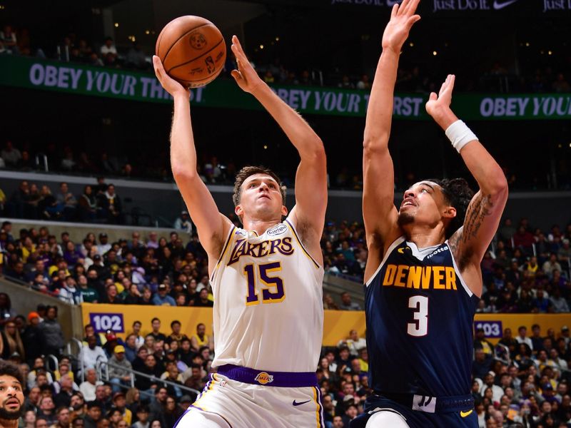 LOS ANGELES, CA - NOVEMBER 23: Austin Reaves #15 of the Los Angeles Lakers drives to the basket during the game against the Denver Nuggets on November 23, 2024 at Crypto.Com Arena in Los Angeles, California. NOTE TO USER: User expressly acknowledges and agrees that, by downloading and/or using this Photograph, user is consenting to the terms and conditions of the Getty Images License Agreement. Mandatory Copyright Notice: Copyright 2024 NBAE (Photo by Adam Pantozzi/NBAE via Getty Images)