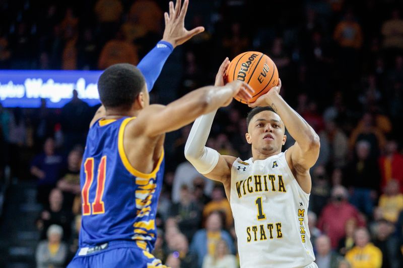 Jan 14, 2023; Wichita, Kansas, USA; Wichita State Shockers guard Xavier Bell (1) looks to shoot the ball over Tulsa Golden Hurricane guard Brandon Betson (11) during the second half at Charles Koch Arena. Mandatory Credit: William Purnell-USA TODAY Sports