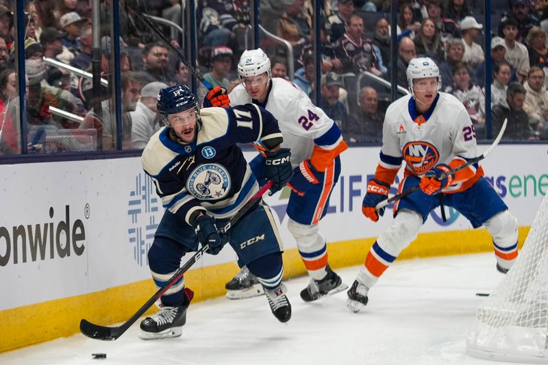 Oct 30, 2024; Columbus, Ohio, USA; Columbus Blue Jackets right wing Justin Danforth (17) skates with the puck against the New York Islanders in the first period at Nationwide Arena. Mandatory Credit: Samantha Madar-Imagn Images