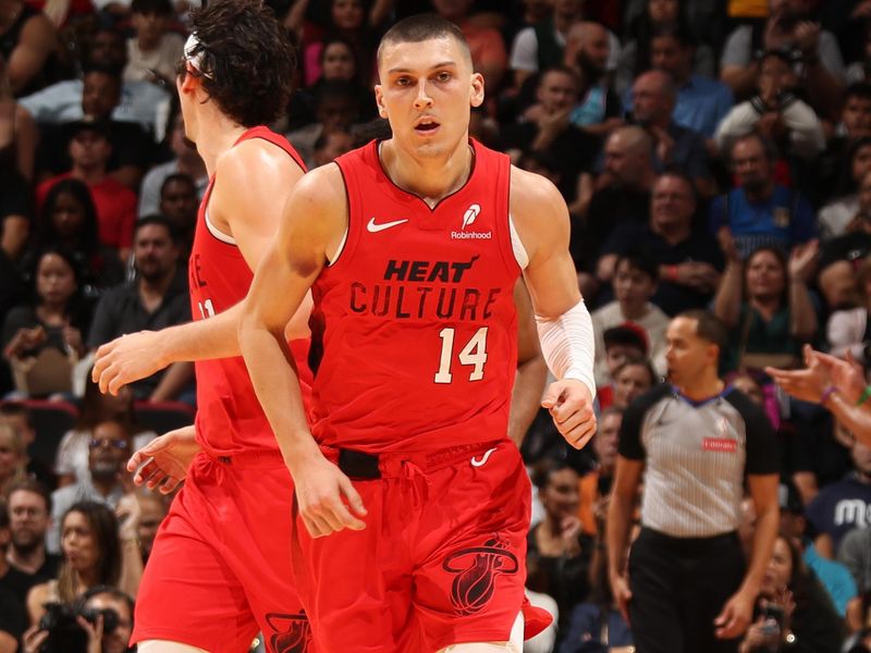 MIAMI, FL - NOVEMBER 24: Tyler Herro #14 of the Miami Heat looks on during the game against the Dallas Mavericks on November 24, 2024 at Kaseya Center in Miami, Florida. NOTE TO USER: User expressly acknowledges and agrees that, by downloading and or using this Photograph, user is consenting to the terms and conditions of the Getty Images License Agreement. Mandatory Copyright Notice: Copyright 2024 NBAE (Photo by Issac Baldizon/NBAE via Getty Images)