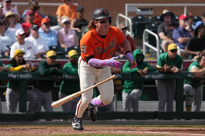 Feb 23, 2026; Scottsdale, Arizona, USA; San Francisco Giants left fielder Harrison Bader (9) hits a single against the Athletics in the third inning at Scottsdale Stadium. Mandatory Credit: Rick Scuteri-Imagn Images