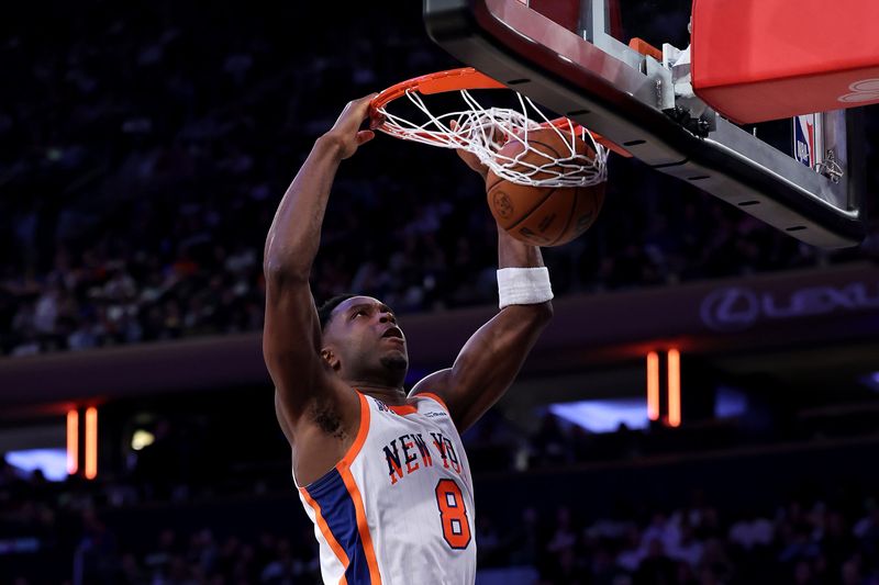 NEW YORK, NEW YORK - NOVEMBER 17: OG Anunoby #8 of the New York Knicks dunks the ball against the Brooklyn Nets during the second half at Madison Square Garden on November 17, 2024 in New York City. NOTE TO USER: User expressly acknowledges and agrees that, by downloading and or using this photograph, User is consenting to the terms and conditions of the Getty Images License Agreement.  (Photo by Luke Hales/Getty Images)