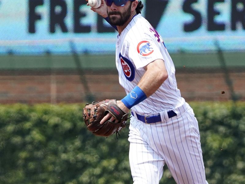 Jun 17, 2023; Chicago, Illinois, USA; Chicago Cubs shortstop Dansby Swanson (7) makes a play against Baltimore Orioles designated hitter Adley Rutschman (not pictured) during the first inning at Wrigley Field. Mandatory Credit: David Banks-USA TODAY Sports