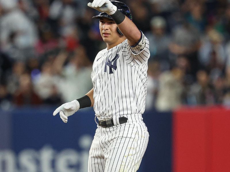 Sep 22, 2023; Bronx, New York, USA; New York Yankees shortstop Anthony Volpe (11) reacts after a double during the fourth inning against the Arizona Diamondbacks at Yankee Stadium. Mandatory Credit: Vincent Carchietta-USA TODAY Sports