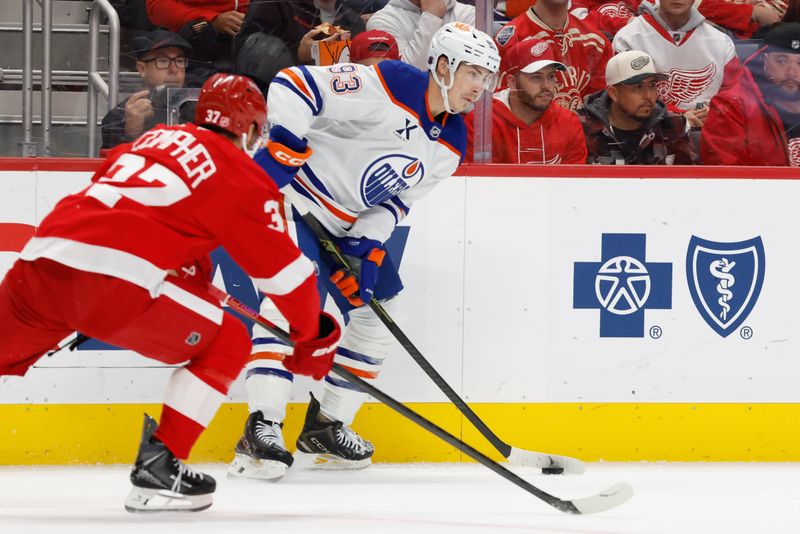 Oct 19, 2025; Detroit, Michigan, USA;  Edmonton Oilers center Ryan Nugent-Hopkins (93) controls the puck against  Detroit Red Wings left wing J.T. Compher (37) in the first period at Little Caesars Arena. Mandatory Credit: Rick Osentoski-Imagn Images