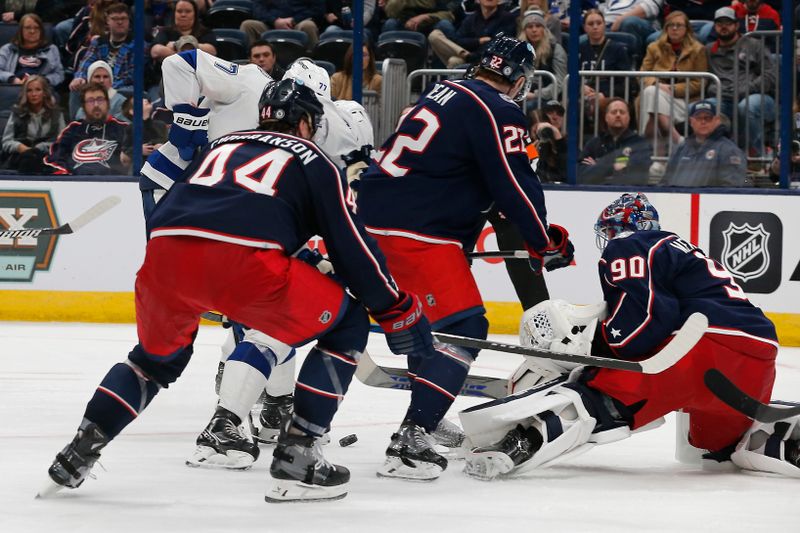 Feb 10, 2024; Columbus, Ohio, USA; Columbus Blue Jackets goalie Elvis Merzlikins (90) makes a save on the shot from Tampa Bay Lightning defenseman Victor Hedman (77) during the third period at Nationwide Arena. Mandatory Credit: Russell LaBounty-USA TODAY Sports