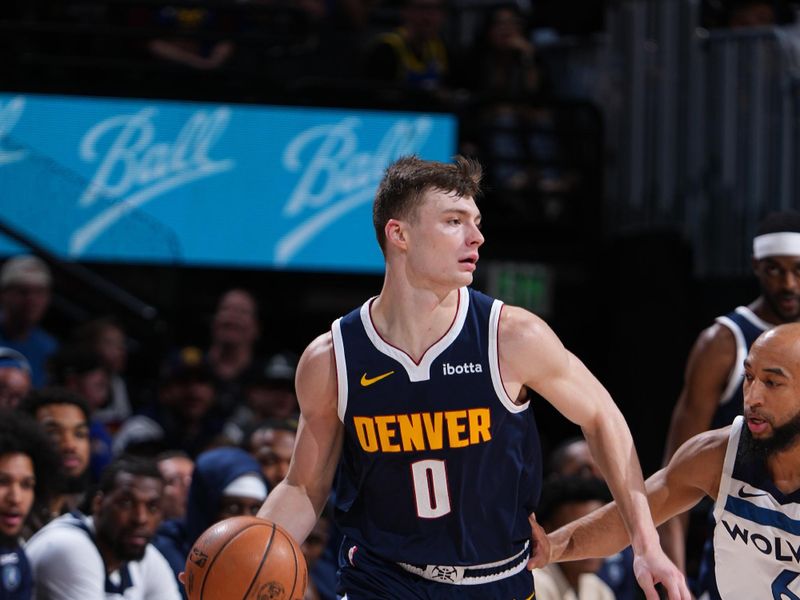 DENVER, CO - APRIL 10:  Christian Braun #0 of the Denver Nuggets dribbles the ball during the game against the Minnesota Timberwolveson April 10, 2024 at the Ball Arena in Denver, Colorado. NOTE TO USER: User expressly acknowledges and agrees that, by downloading and/or using this Photograph, user is consenting to the terms and conditions of the Getty Images License Agreement. Mandatory Copyright Notice: Copyright 2024 NBAE (Photo by Garrett Ellwood/NBAE via Getty Images)