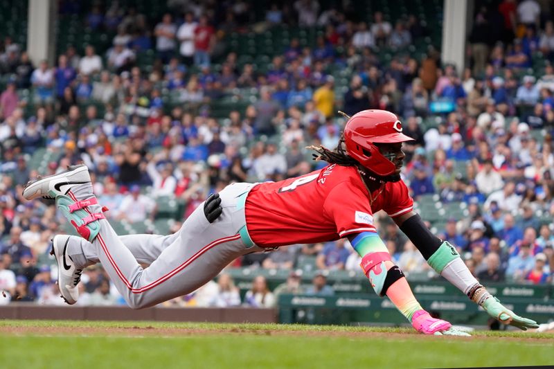 Sep 27, 2024; Chicago, Illinois, USA; Cincinnati Reds shortstop Elly De La Cruz (44) slides into third base against the Chicago Cubs during the first inning at Wrigley Field. Mandatory Credit: David Banks-Imagn Images