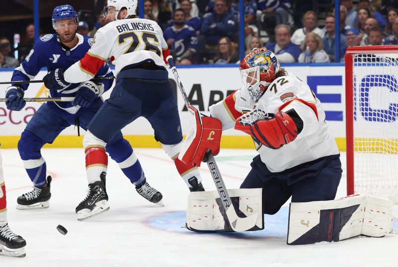 Apr 30, 2025; Tampa, Florida, USA; Florida Panthers goaltender Sergei Bobrovsky (72) makes a save against the Tampa Bay Lightning during the first period of game five of the first round of the 2025 Stanley Cup Playoffs at Amalie Arena. Mandatory Credit: Kim Klement Neitzel-Imagn Images