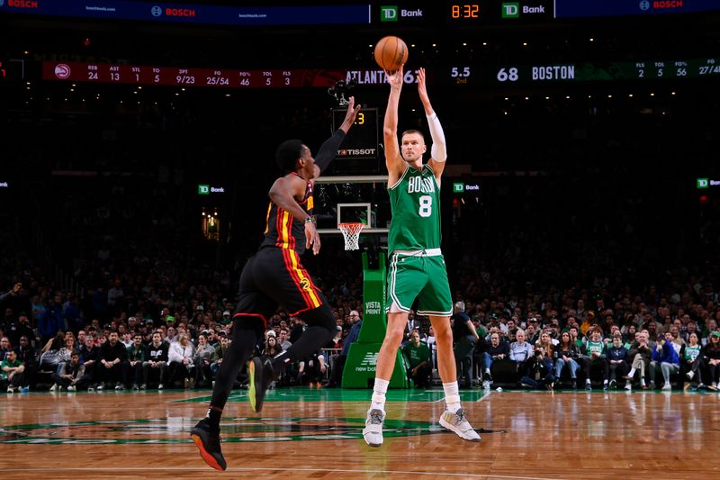 BOSTON, MA - FEBRUARY 7: Kristaps Porzingis #8 of the Boston Celtics shoots a three point basket during the game against the Atlanta Hawks on February 7, 2024 at the TD Garden in Boston, Massachusetts. NOTE TO USER: User expressly acknowledges and agrees that, by downloading and or using this photograph, User is consenting to the terms and conditions of the Getty Images License Agreement. Mandatory Copyright Notice: Copyright 2024 NBAE  (Photo by Brian Babineau/NBAE via Getty Images)