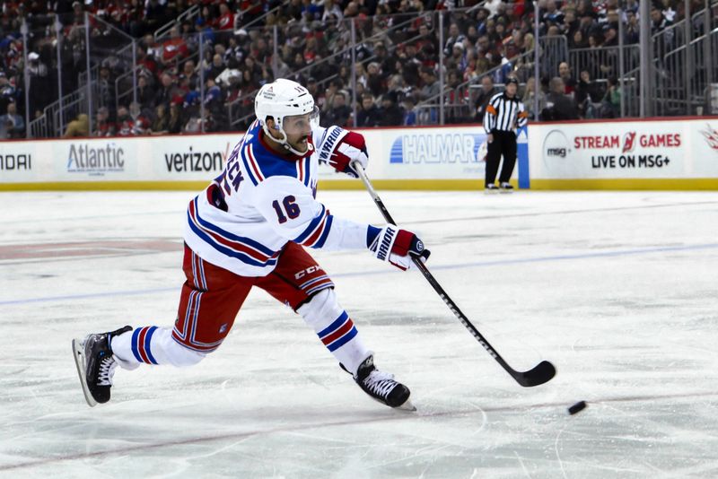 Nov 18, 2023; Newark, New Jersey, USA; New York Rangers center Vincent Trocheck (16) shoots the puck against the New Jersey Devils during the third period at Prudential Center. Mandatory Credit: John Jones-USA TODAY Sports