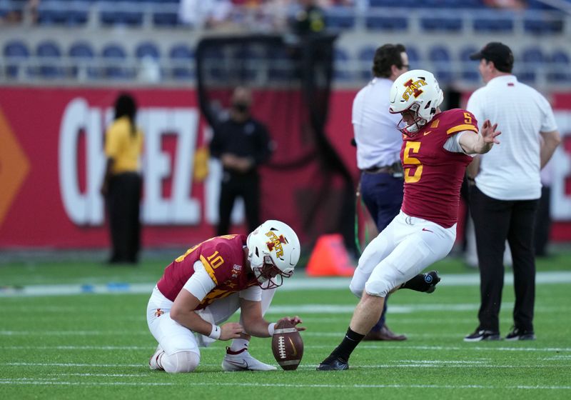 Dec 29, 2021; Orlando, Florida, USA; Iowa State Cyclones place kicker Andrew Mevis (5) kicks during pregame warmups before the 2021 Cheez-It Bowl against the Clemson Tigers at Camping World Stadium. Mandatory Credit: Jasen Vinlove-USA TODAY Sports