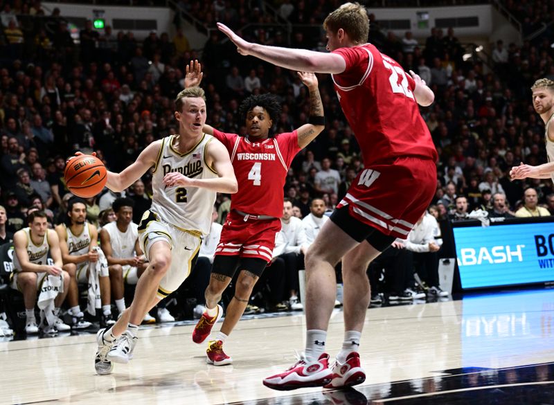 Mar 10, 2024; West Lafayette, Indiana, USA; Purdue Boilermakers guard Fletcher Loyer (2) runs into Wisconsin Badgers forward Steven Crowl (22) during a drive to the basket in the second half at Mackey Arena. Mandatory Credit: Marc Lebryk-USA TODAY Sports