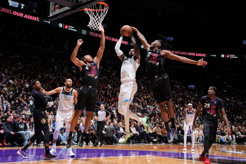 TORONTO, CANADA - NOVEMBER 21: Julius Randle #30 of the Minnesota Timberwolves drives to the basket during the game against the Toronto Raptors on November 21, 2024 at the Scotiabank Arena in Toronto, Ontario, Canada.  NOTE TO USER: User expressly acknowledges and agrees that, by downloading and or using this Photograph, user is consenting to the terms and conditions of the Getty Images License Agreement.  Mandatory Copyright Notice: Copyright 2024 NBAE (Photo by Mark Blinch/NBAE via Getty Images)