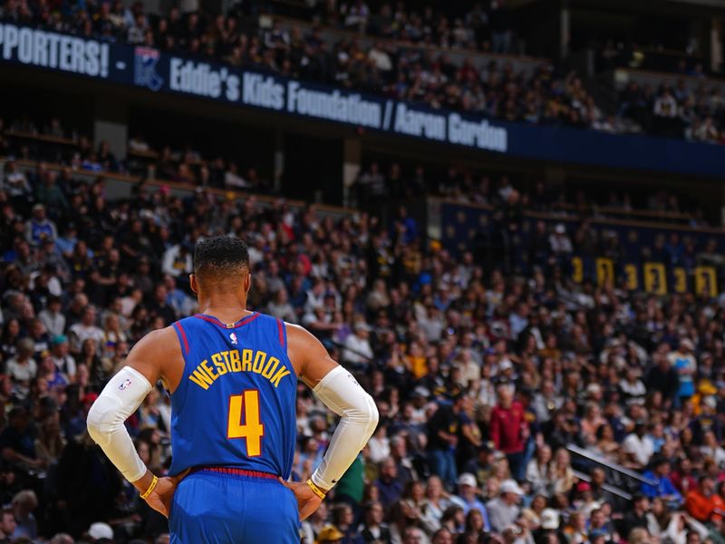 DENVER, CO - NOVEMBER 22: Russell Westbrook #4 of the Denver Nuggets looks on during the game against the Dallas Mavericks during the Emirates NBA Cup game on November 22, 2024 at Ball Arena in Denver, Colorado. NOTE TO USER: User expressly acknowledges and agrees that, by downloading and/or using this Photograph, user is consenting to the terms and conditions of the Getty Images License Agreement. Mandatory Copyright Notice: Copyright 2024 NBAE (Photo by Garrett Ellwood/NBAE via Getty Images)