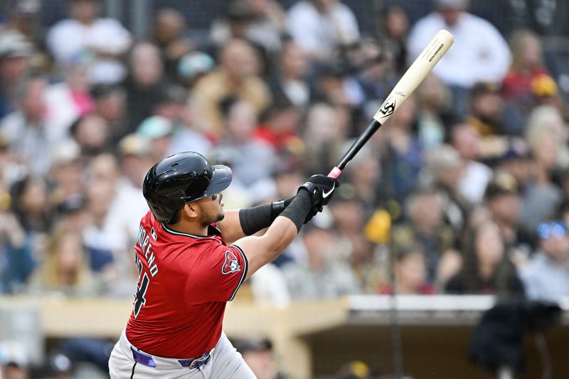 Jun 6, 2024; San Diego, California, USA; Arizona Diamondbacks catcher Gabriel Moreno (14) hits a solo home run during the second inning against the San Diego Padres at Petco Park. Mandatory Credit: Denis Poroy-USA TODAY Sports at Petco Park. 